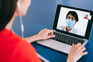 someone speaking with a healthcare practitioner via zoom call to make a perscription