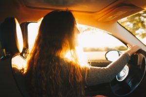 girl traveling alone driving in car