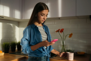 a young Latina woman looking at her mobile phone