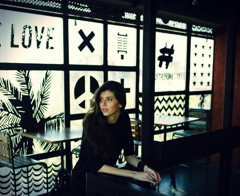Woman sitting at a table in a coffee shop