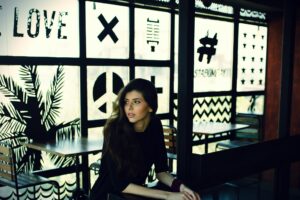 Woman sitting at a table in a coffee shop