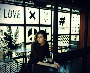 Woman sitting at a table in a coffee shop