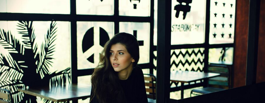 Woman sitting at a table in a coffee shop